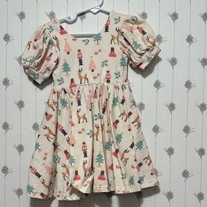 Festive Cream Kids Dress with Reindeer and Tree Print
